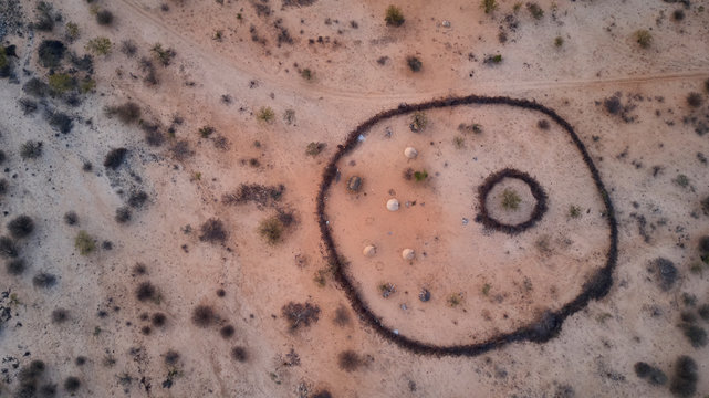Aerial view of Txitundo Hulo, village Kimbos, surrounded by village fence, in Angola