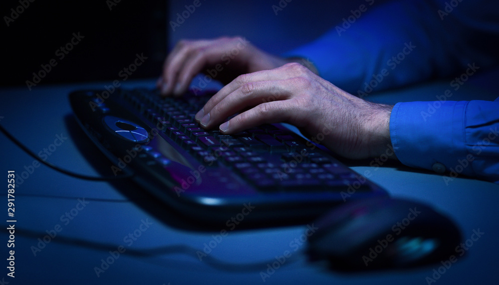 Poster Hacker hacking the server in the dark room