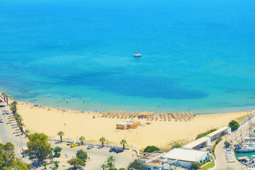 Sea, beach, port with yachts and coastal road, top view. Sidi Bou Said, Mediterranean, Tunisia - June 2019