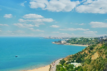 Fototapeta na wymiar Sea, beach, promenade and coastal road in Sidi Bou said, top view. Mediterranean marine landscape, Tunisia. June, 2019