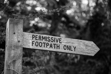 Black and white image of a Permissive Footpath Only sign