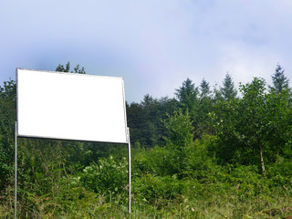 advertising board in nature among trees