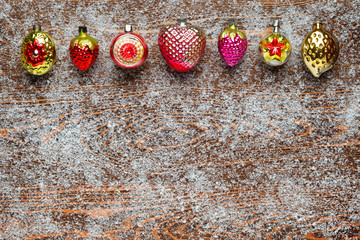 Pattern of antique Christmas toys on a Board covered with frost