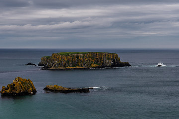 Ireland - coast view, green landscape, rough coasts, cliffs, monastery, graveyards and cloisters