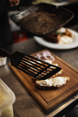 Professional chef working in restaurant kitchen and making delicious traditional food.