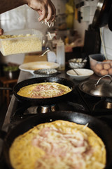Professional chef working in restaurant kitchen and making delicious traditional food.