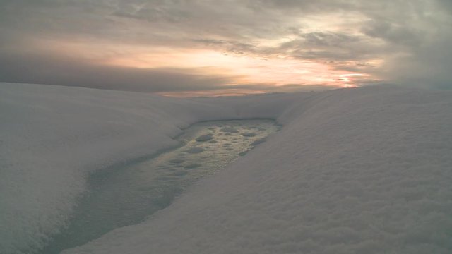 Wide, suns sets over Greenland tundra