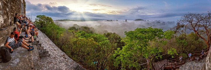 Tikal, Tourists watching sunrise from Temple IV, Guatemala