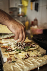 Professional chef working in restaurant kitchen and making delicious traditional food.