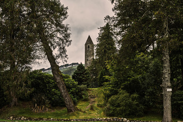 Fototapeta na wymiar Ireland - coast view, green landscape, rough coasts, cliffs, monastery, graveyards and cloisters