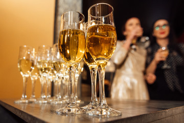 glasses of champagne are on the table