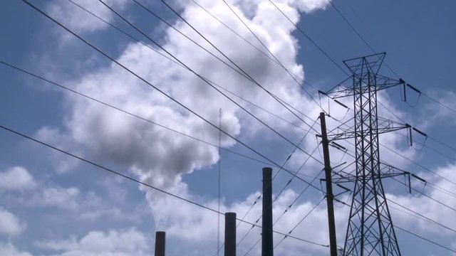 Industrial plant releases smoke, low angle