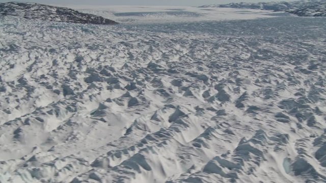 Flying over Store Glacier in Greenland, helicopter point of view