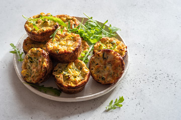 zucchini corn egg muffins on a table