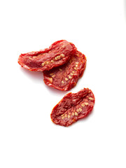 Sun Dried tomatoes in the sunshine on white