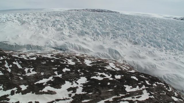 Flying over polar glacier, helicopter point of view