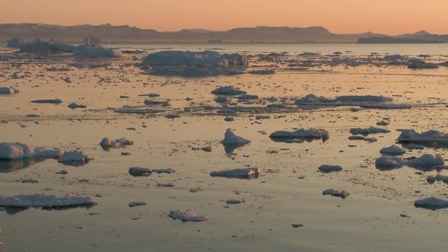 Sunset over melted sea ice, wide timelapse