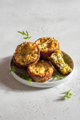zucchini corn egg muffins on a table