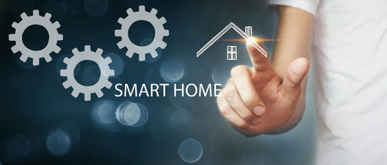 man clicks on the screen to configure smart home settings