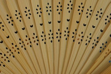 brown wooden texture from an old open fan with a pattern