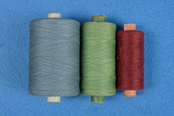 set of spools of colored thread