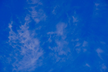 Fototapeta na wymiar Smoky clouds in the blue sky.