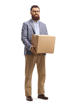 Bearded man standing and holding a cardboard box
