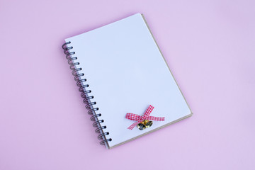 Notebook for recording Christmas wishes and plans. The concept of organizing Christmas holidays. Minimalistic style. Flatlay.