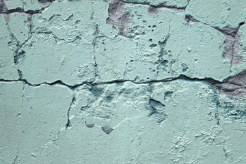 Wall texture with old plaster. Close-up photo. Urban background.