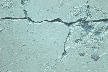 Wall texture with old plaster. Close-up photo. Urban background.