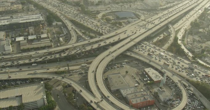 Helicopter aerial shot steady on Los Angeles freeway, overcast day