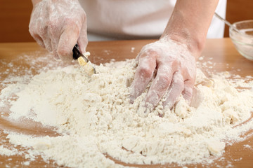 A baker cutting butter. Making Pastry Dough for Hungarian Cake. Series.