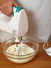 Whisking Cream for filling. Making Chocolate Layer Cake. Series.