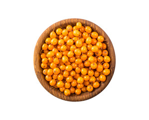 Sea buckthorn. Seabuckthorn in a wooden bowl isolated on white. Fresh ripe berry with leaves isolated on white background. Top view. Orang berry on white.