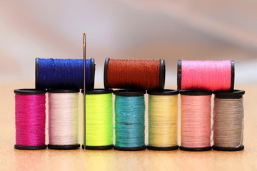  Colorful cotton reels  and needle.