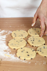 Rounds of raw cookies. Making Chocolate Chip Cookies. Series.