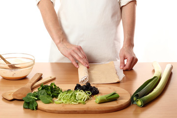 Roll out dough. Making Pizza with Leek and Spinach. Series.