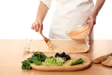 Pouring Tomato Sauce on Dough. Making Pizza with Leek and Spinach. Series.