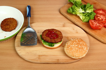 Spread Ketchup on Patty. Making Hamburger. Series.