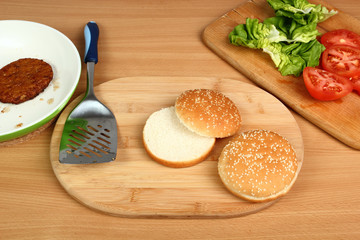 Ingredients for making hamburger: Bread Roll, Patty, Lettuce, Tomato.