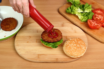 Spread Ketchup on Patty. Making Hamburger. Series.