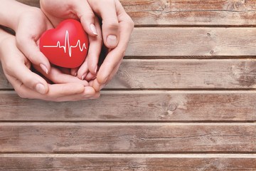 Close-up red Heart in hands, love concept