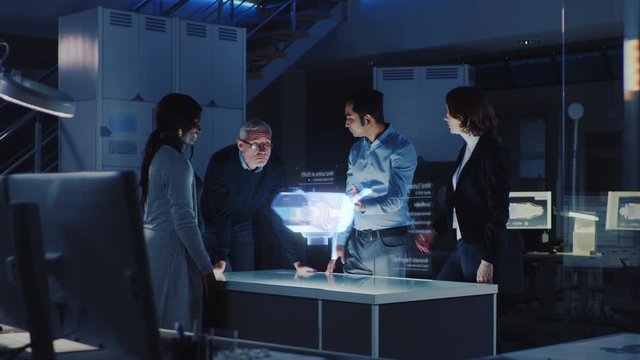 Group of Civil Engineers Work with Holographic Augmented Reality 3D Wind Turbine Model. Technologically Advanced Office Professional People Use Virtual Reality Modeling Software Application. - Powered by Adobe