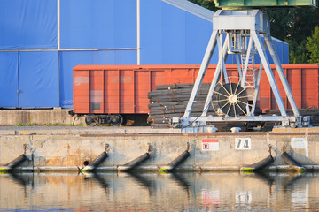 Steel reinforcement in the port, port crane and railway wagon.
