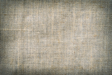 Natural canvas, sackcloth. Closeup of jute texture pattern with vignette, for vintage background