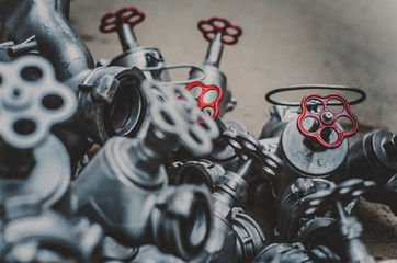 Industrial valves with red wheels. close-up of pipe valve connection