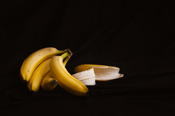 fresh yellow babnana close up on black background