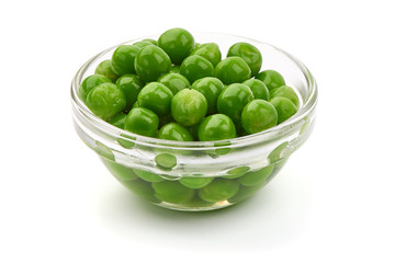 Fresh green peas in a bowl, isolated on white background