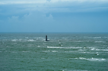 Fototapeta premium Le phare des Baleineaux is a Lighthouse located 3 km from the northwest of the Ile de Re