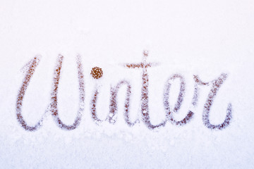 Text WINTER written in snow